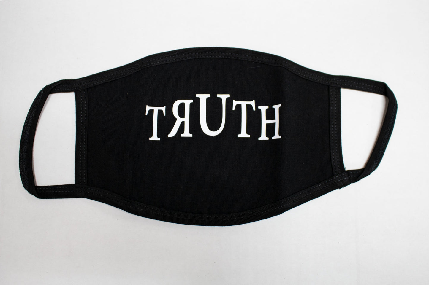 Ligorano Reese's cotton polyester blend face mask that says it like it really us - The Truth - for all to see. Made in the Brooklyn Navy Yard.Ligorano Reese face mask, produced during the early days of COVID. From Pure Products USA.